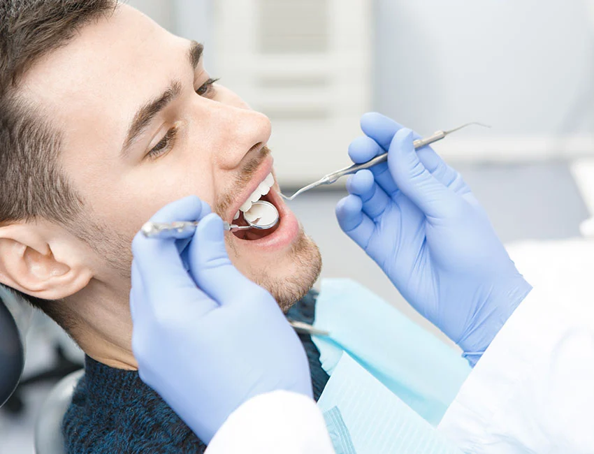Dentist checking patients teeth in Mission Viejo