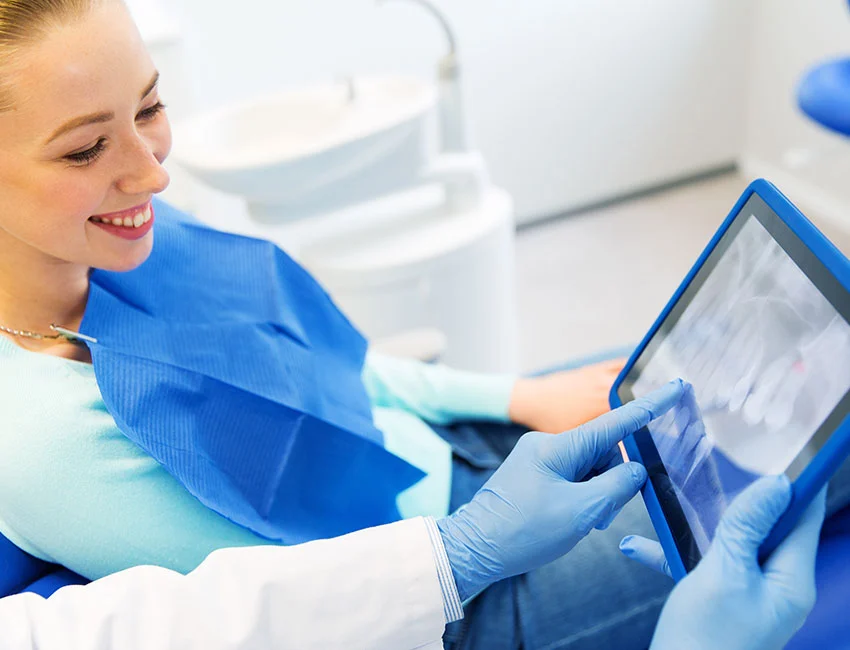Dentist looking at X-Ray