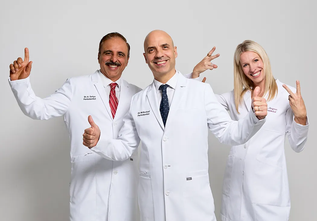 The smiling doctors of OC Perio & Implants Dental Group
